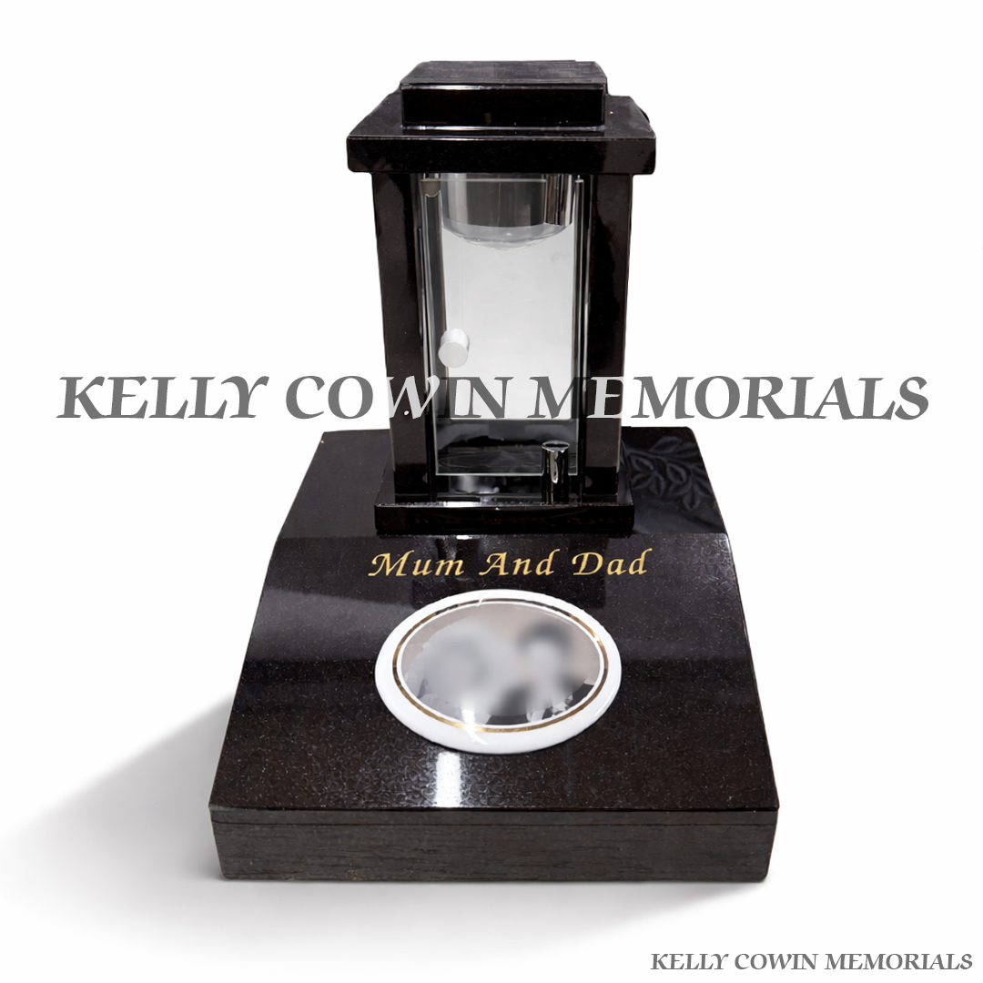 Front view of black granite solar lantern on sloped block with gold engraving and oval ceramic photo