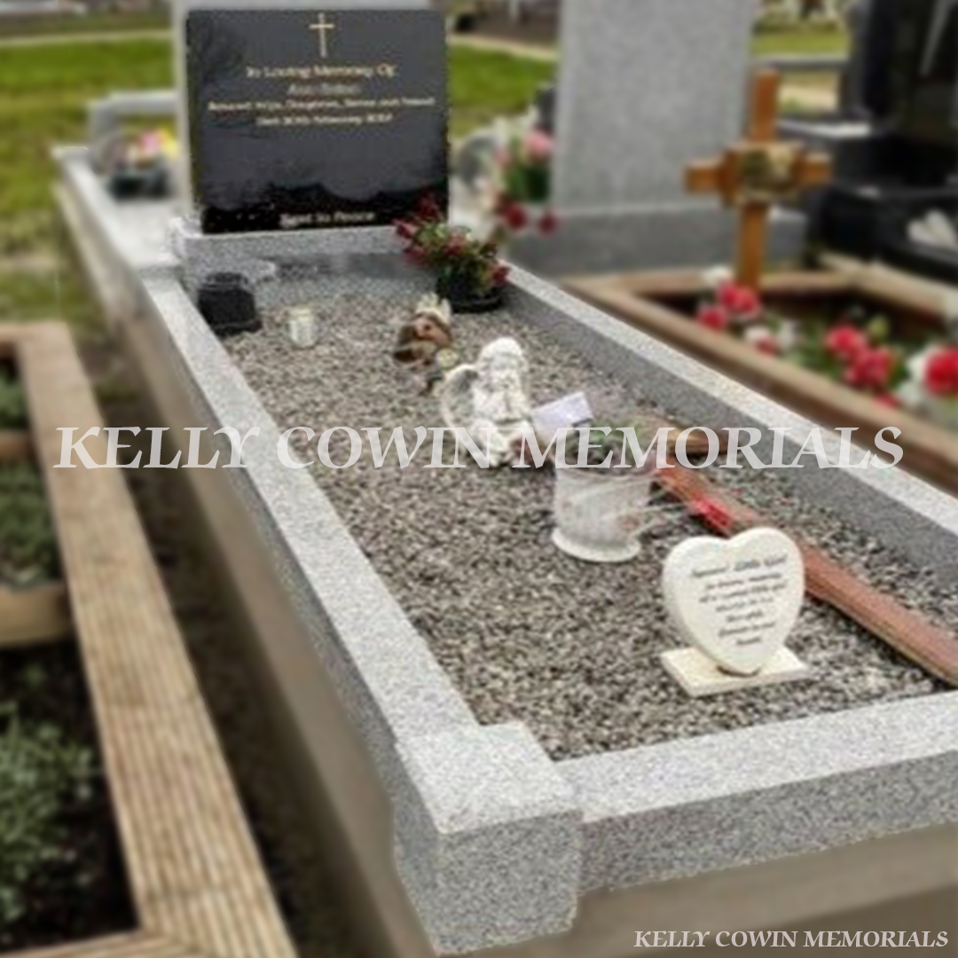 Side view of black granite square headstone with grey kerbing in Fingal Cemetery Dublin