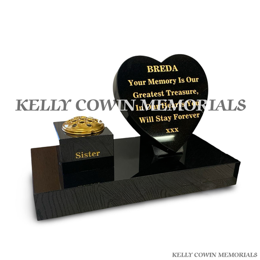 Side view of black granite memorial set with vase, heart and gold lid