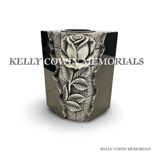Front view of black granite square vase with carved rose design