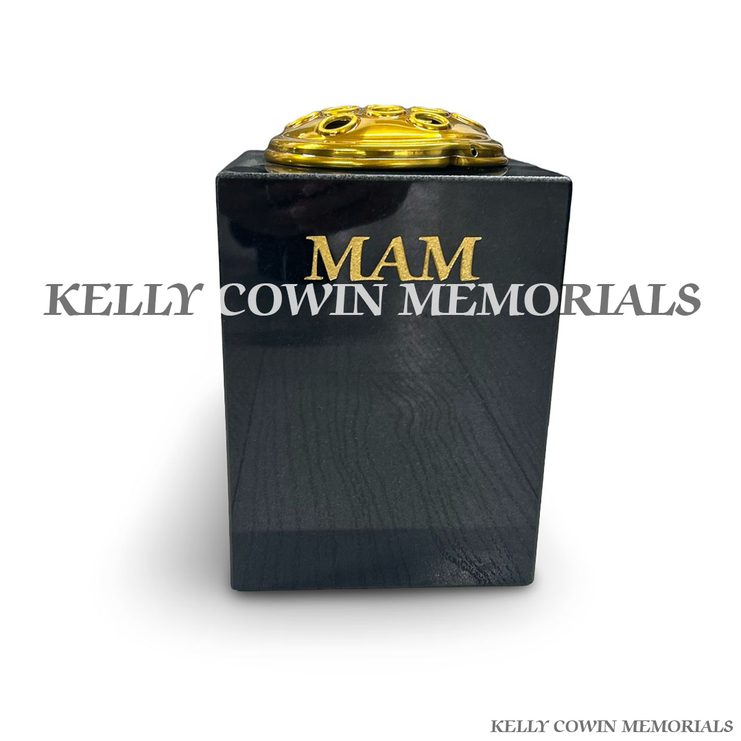 Front view of black granite square vase with gold Mam inscription and gold lid