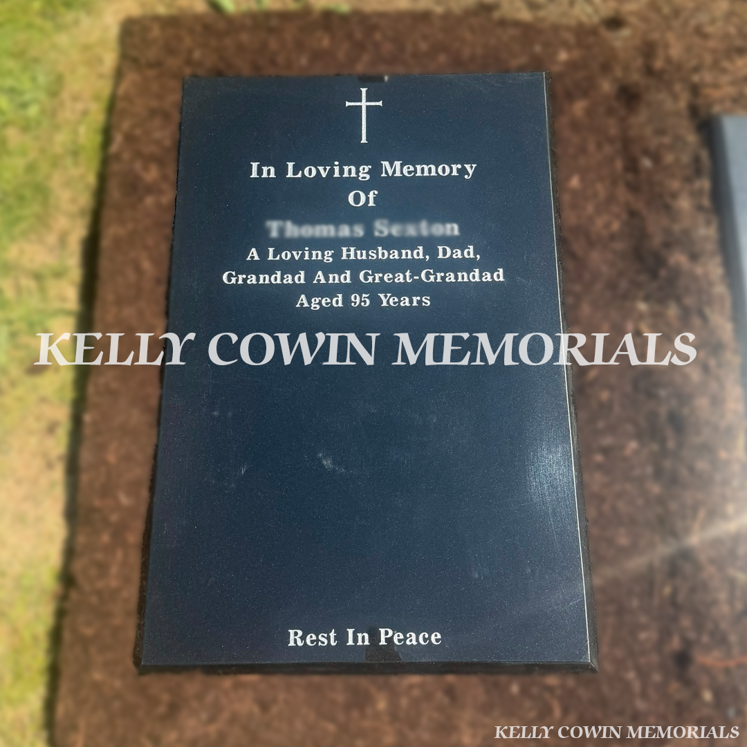 Black granite St Fintan's headstone with silver inscription installed in St Fintan's Cemetery, Sutton by Kelly Cowin Memorials.