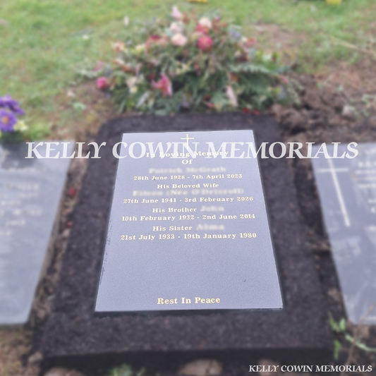 Front view of black granite St. Fintan’s headstone with gold inscription in Sutton