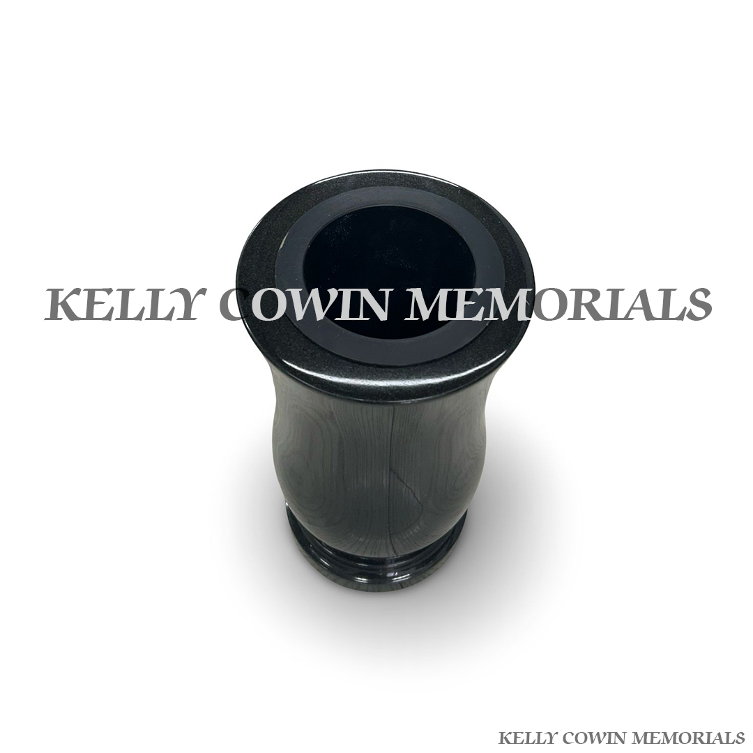 Close-up of black granite polished finish on tall vase
