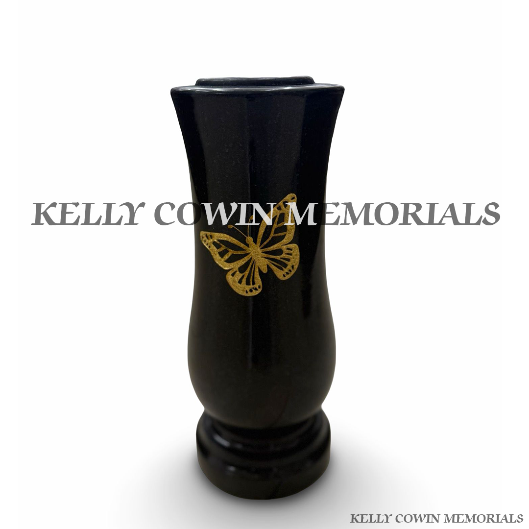 Front view of black granite tall vase with gold inscription and butterfly engraving