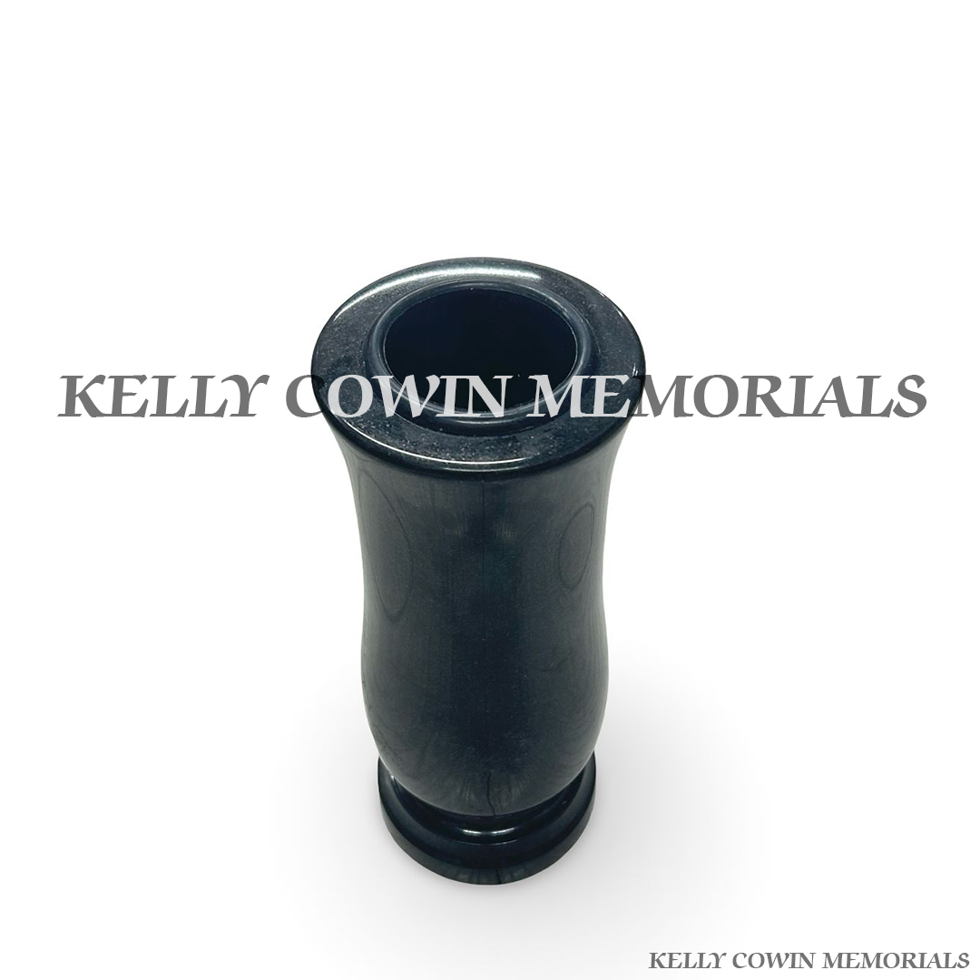 Close-up of black granite polished finish on tall vase