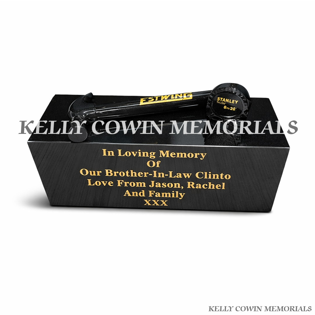 Front view of black granite hammer and measuring tape memorial accessory
