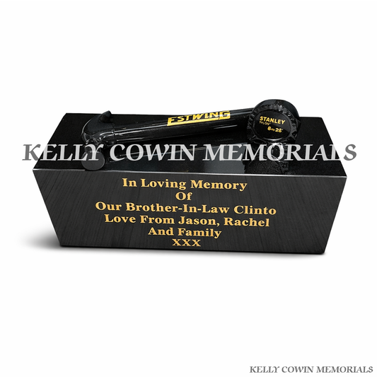 Front view of black granite hammer and measuring tape memorial accessory