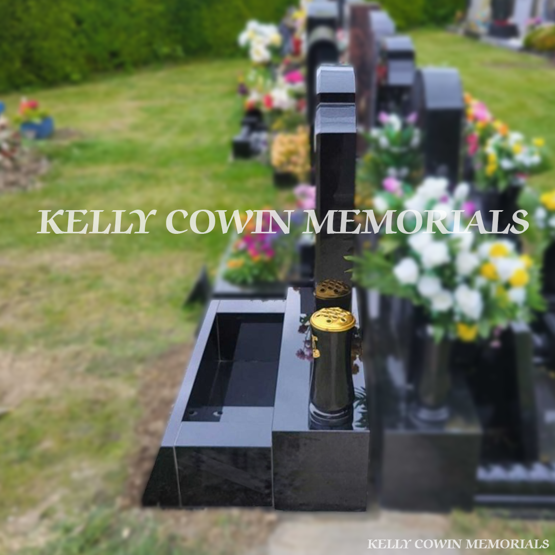 Side view of black granite Top Nine memorial on sub-base, base and plinth