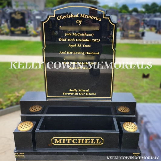 Front view of Black Granite Top Nine headstone with gold inscription, flower box and square vases in Balgriffin Cemetery Dublin