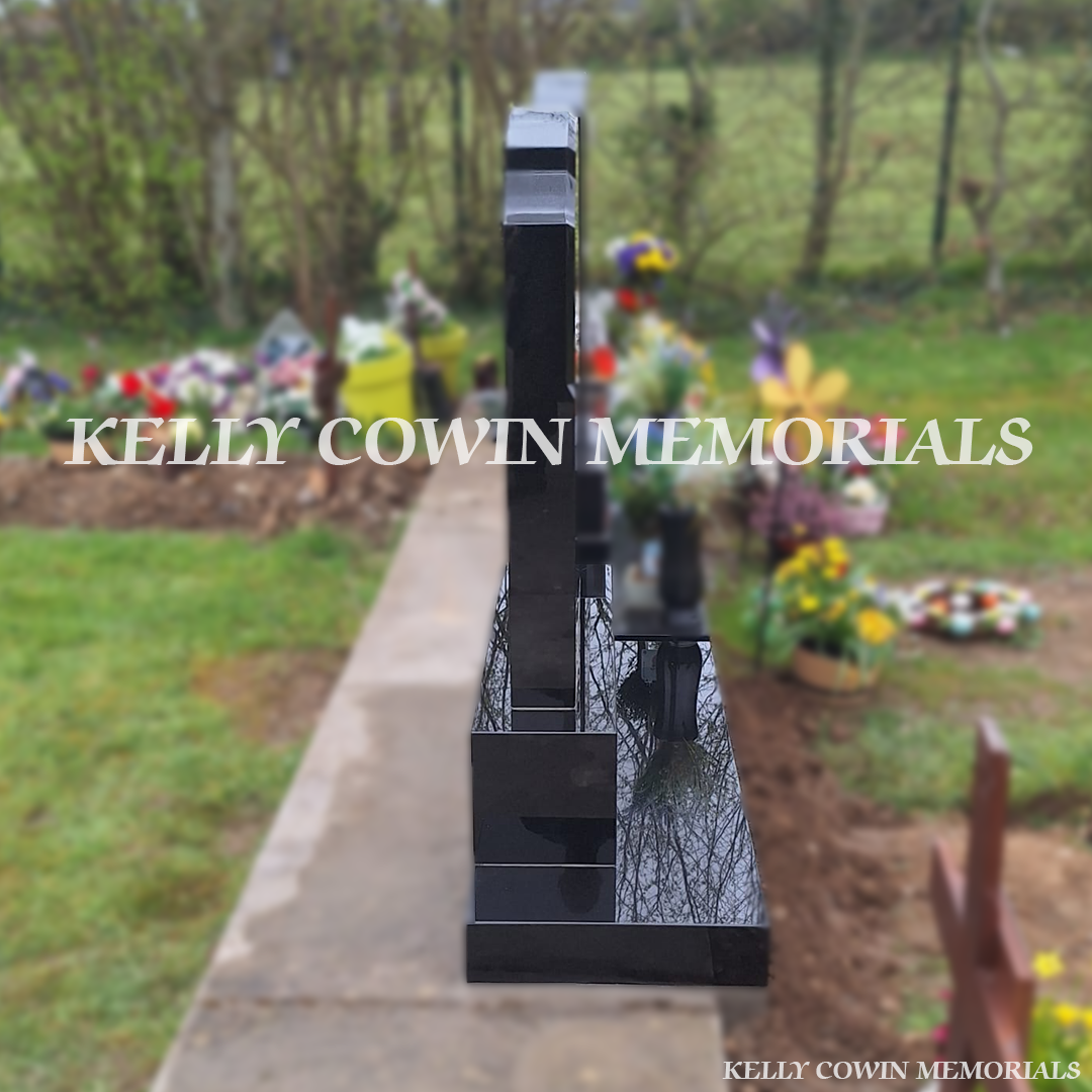 Side view of black granite Top Nine memorial on base and plinth