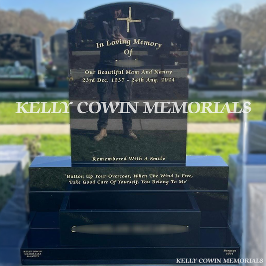 Front view of Black Granite Top Nine headstone with gold inscription and flower box on sub-base and plinth in Balgriffin Cemetery Dublin