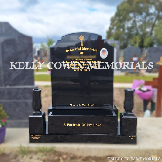 Front view of black granite Top Nine headstone with gold lettering in Balgriffin Cemetery