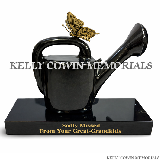 Front view of black granite watering can memorial accessory with bronze butterfly