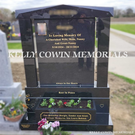 Front view of Black Granite headstone with cap, pillars, flower box and square ceramic photograph in Balgriffin Cemetery Dublin