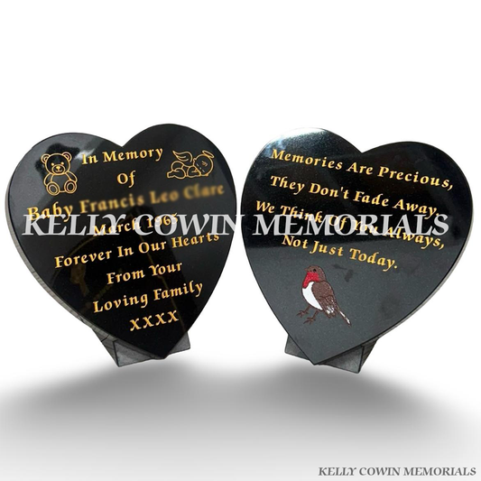 Two 12 inch black granite heart memorial plaques with personalised gold engraved wording and custom teddy bear, angel and robin images by Kelly Cowin Memorials Ireland.