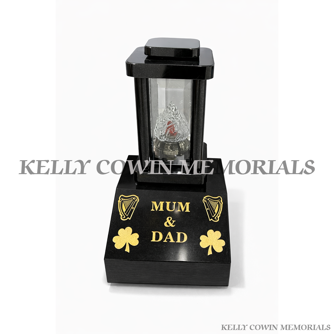 Black granite memorial lantern on engraved sloped vase base grave tribute light Ireland