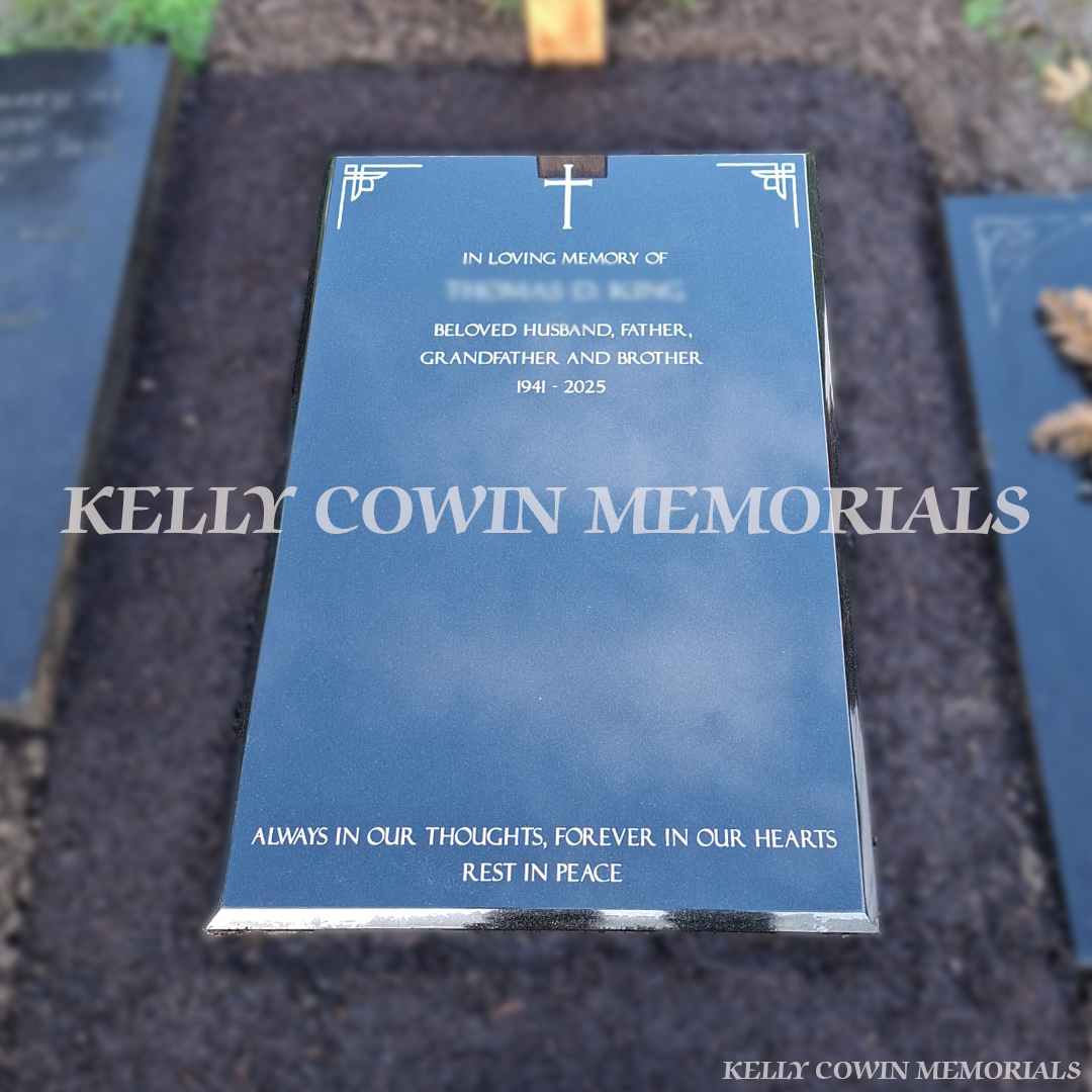 Black granite St. Fintan’s style headstone with silver inscription installed in St. Fintan’s Cemetery Sutton by Kelly Cowin Memorials