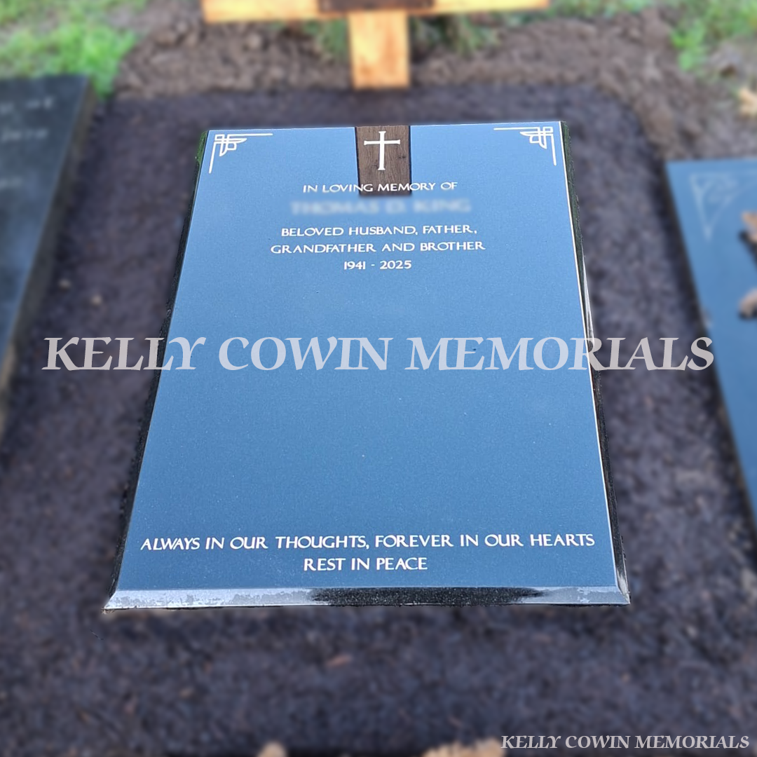 Front view of a Black granite St. Fintan’s style headstone with silver inscription installed in St. Fintan’s Cemetery Sutton by Kelly Cowin Memorials