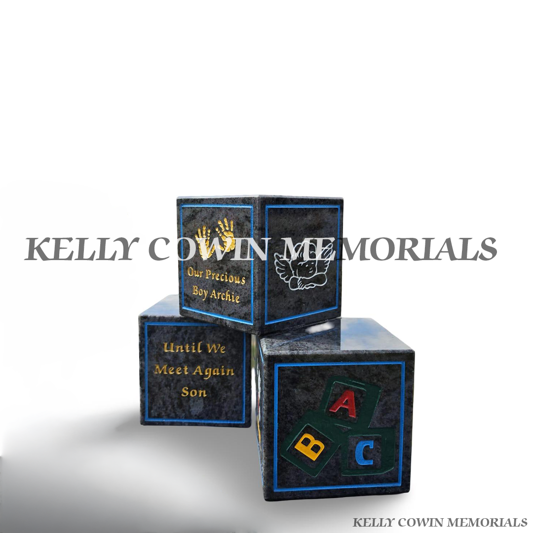 side view of Personalised Blue Lagoon granite baby memorial blocks with coloured engraved wording, numbers, handprints and child-themed memorial images by Kelly Cowin Memorials.
