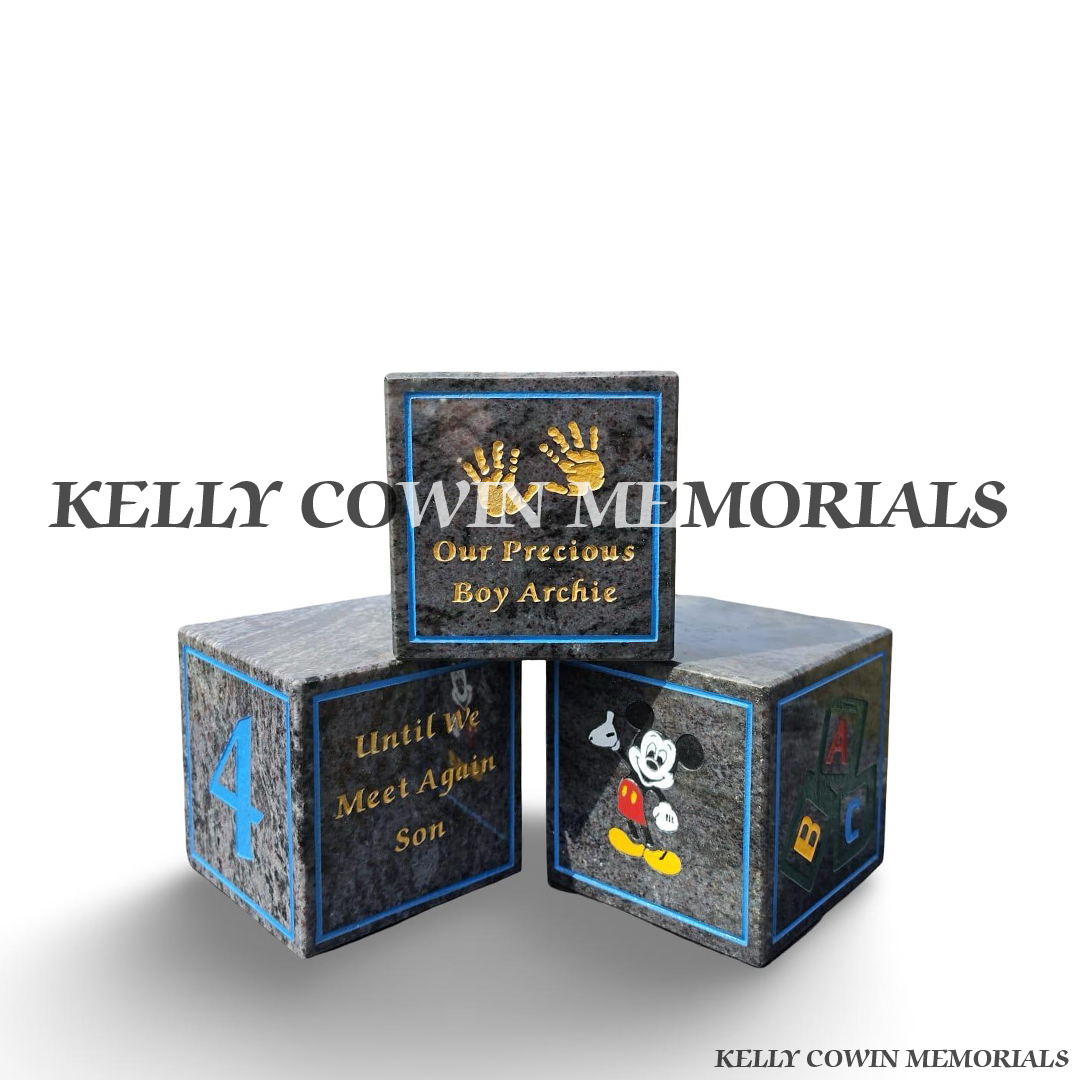 face view of Personalised Blue Lagoon granite baby memorial blocks with coloured engraved wording, numbers, handprints and child-themed memorial images by Kelly Cowin Memorials.