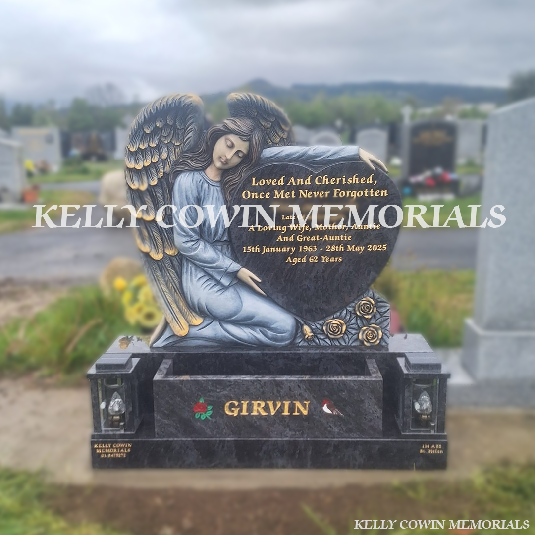 Front view of Blue Lagoon angel holding heart headstone with gold leaf inscription in Shanganagh Cemetery