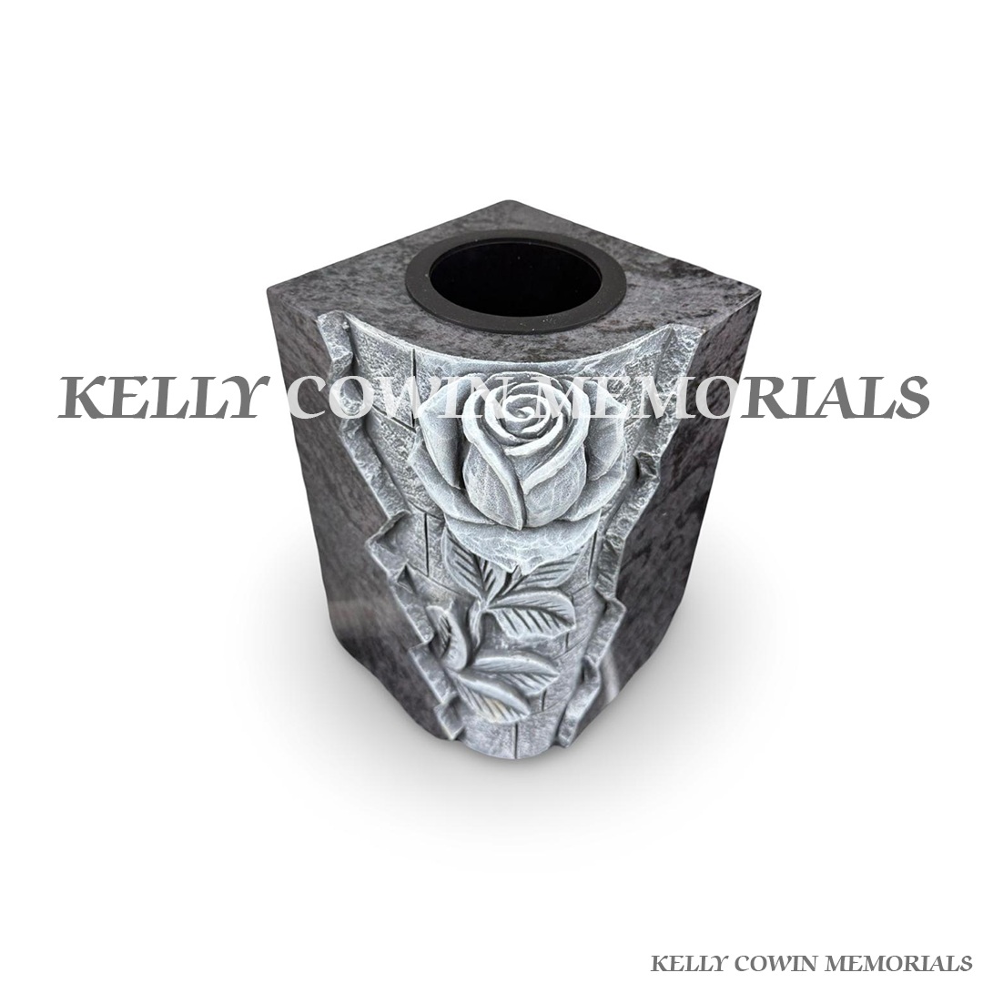 Front view of Blue Lagoon square vase with carved rose design