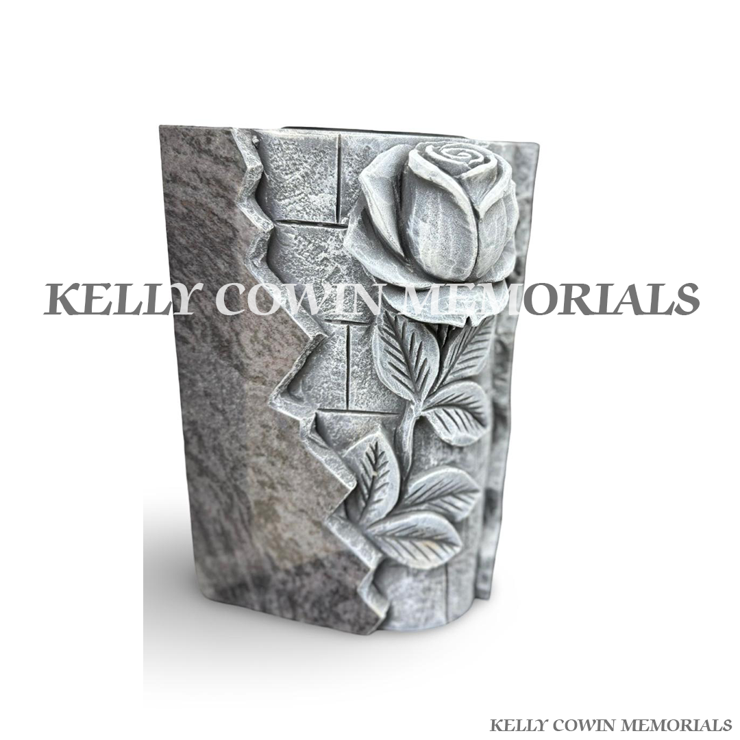 Side view of Blue Lagoon granite vase with antique rose carving