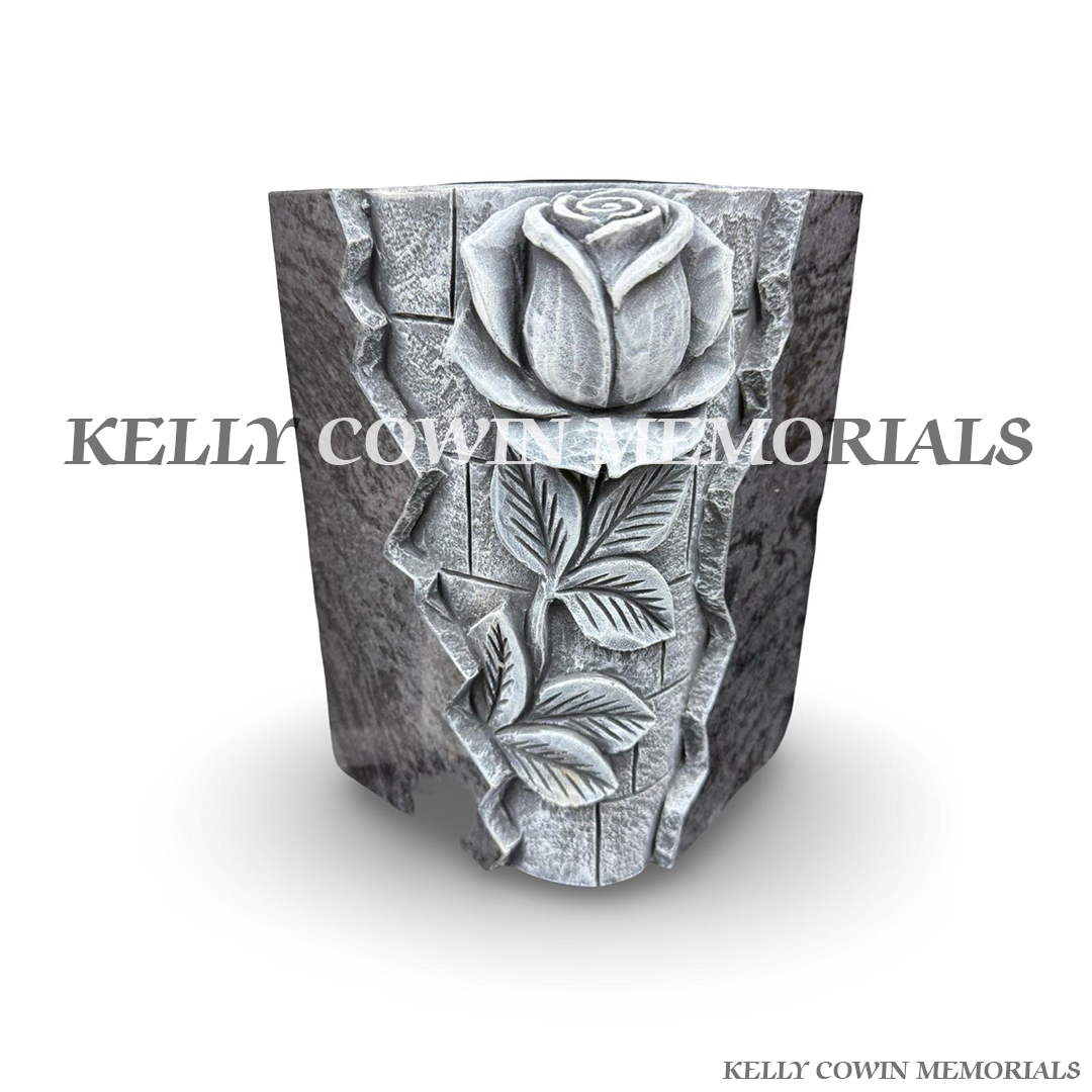 Close up view of Blue Lagoon granite vase with antique rose carving