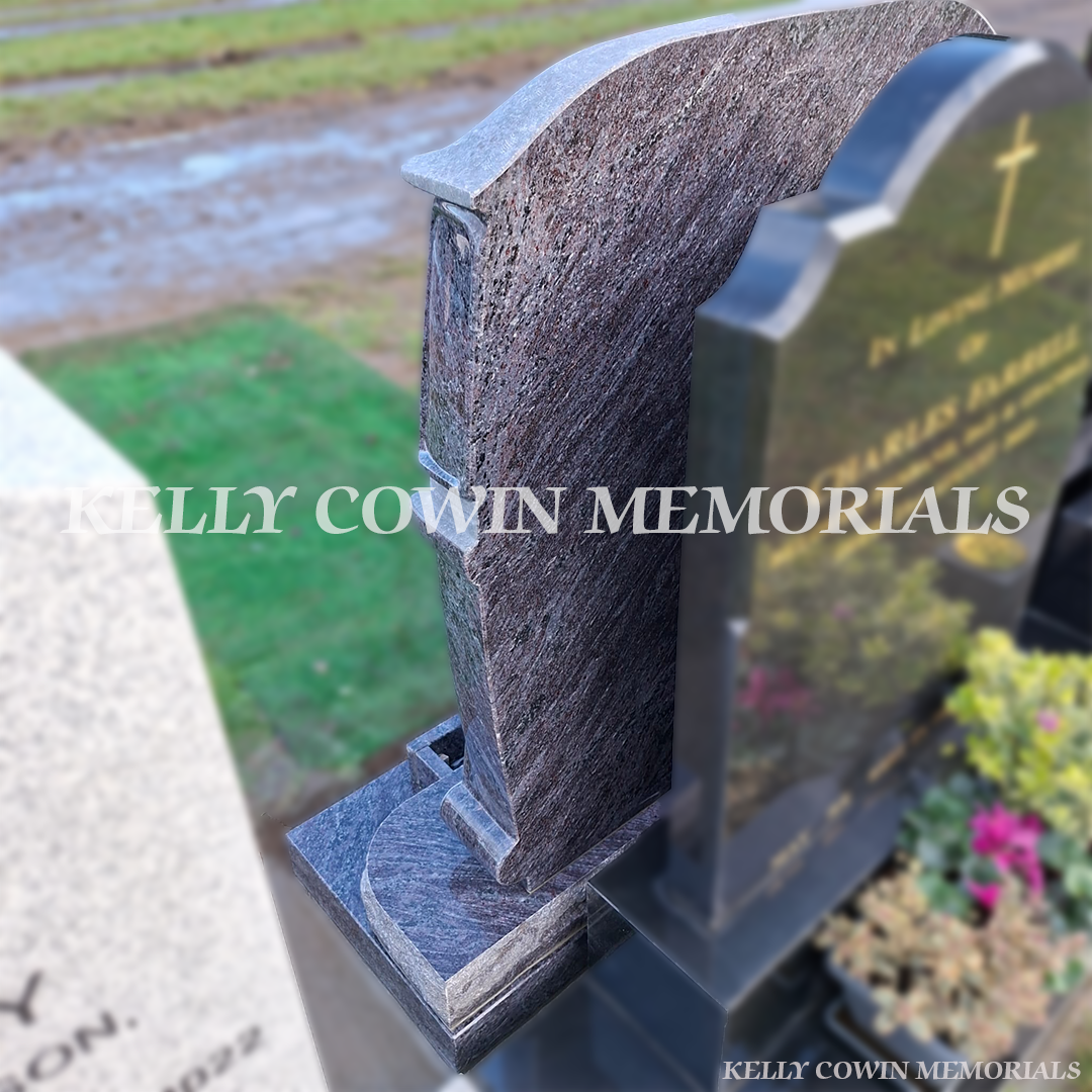 “Blue Lagoon custom campervan headstone with base, plinth and flower box installed in Shanganagh Cemetery Dublin by Kelly Cowin Memorials”