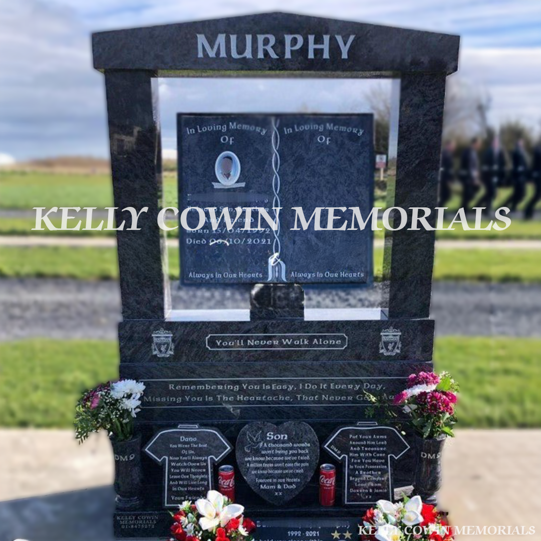 Front view of Blue Lagoon book headstone with silver inscription, jersey plaques and oval ceramic photograph in Dardistown Cemetery Dublin
