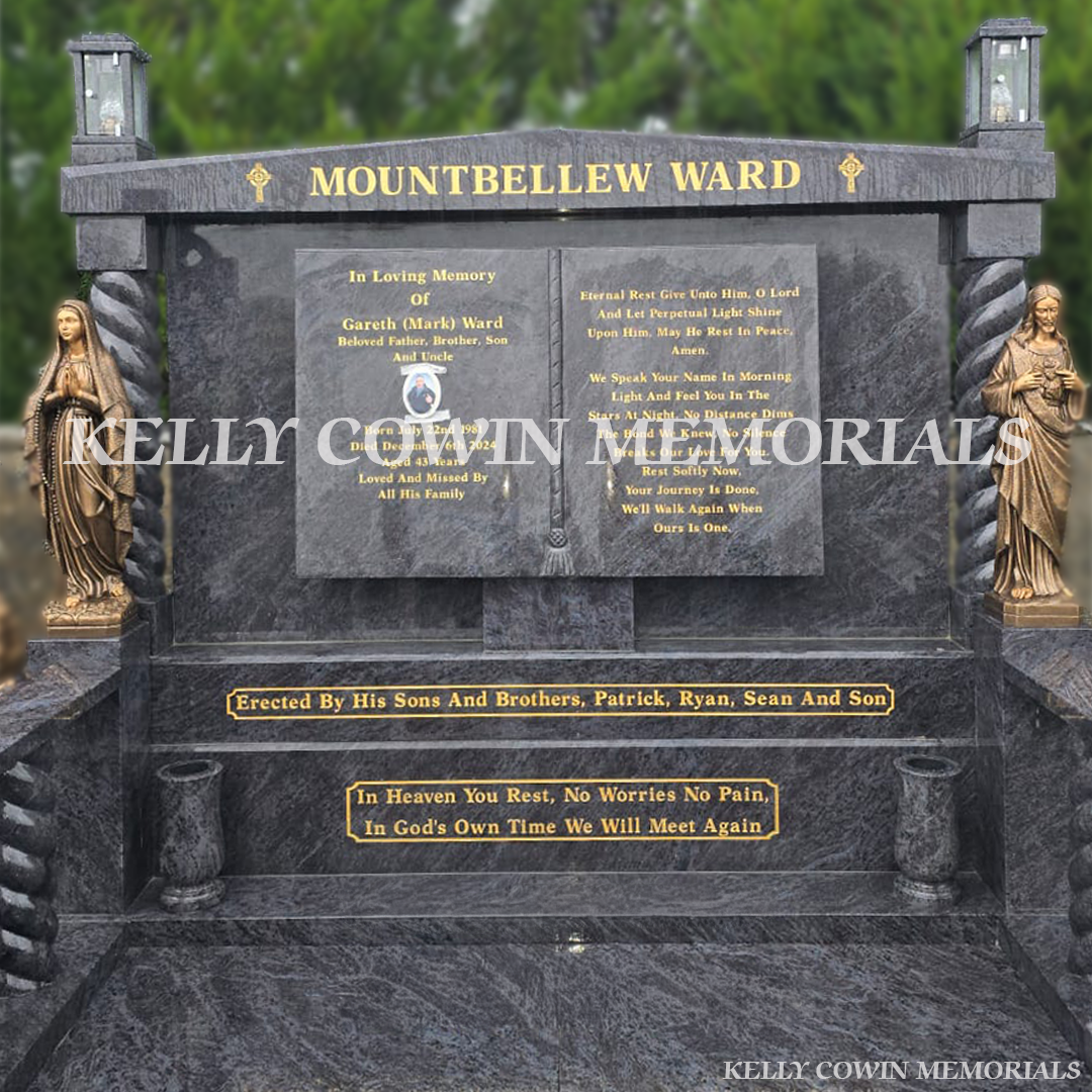 Blue Lagoon granite book headstone with twisted pillars, bronze religious statues and gold leaf inscription in Mount Bellew Cemetery, Galway
