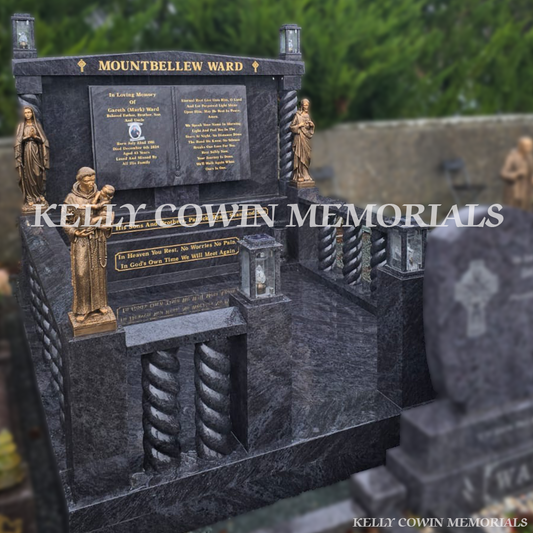 Blue Lagoon granite book headstone with twisted pillars, bronze religious statues and gold leaf inscription in Mount Bellew Cemetery, Galway