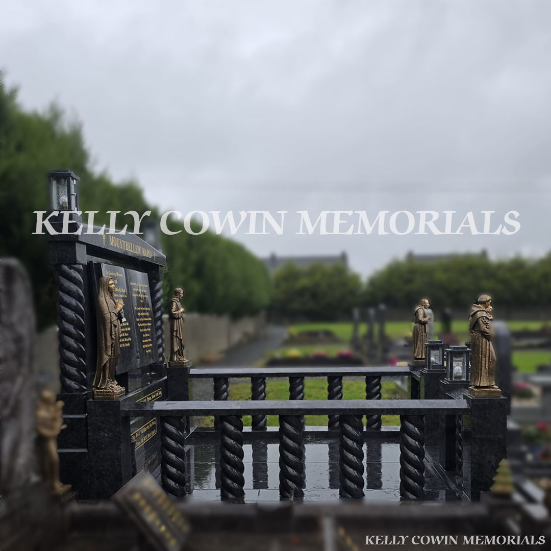 Blue Lagoon granite book headstone with twisted pillars, bronze religious statues and gold leaf inscription in Mount Bellew Cemetery, Galway
