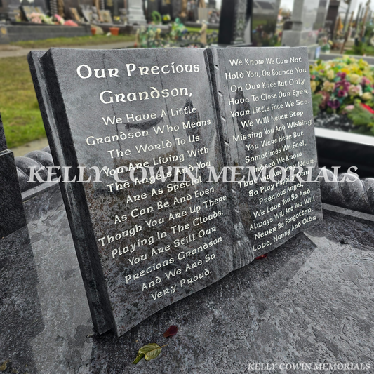 Blue Lagoon granite memorial book plaque with silver engraved poem and ribbon spine detail.