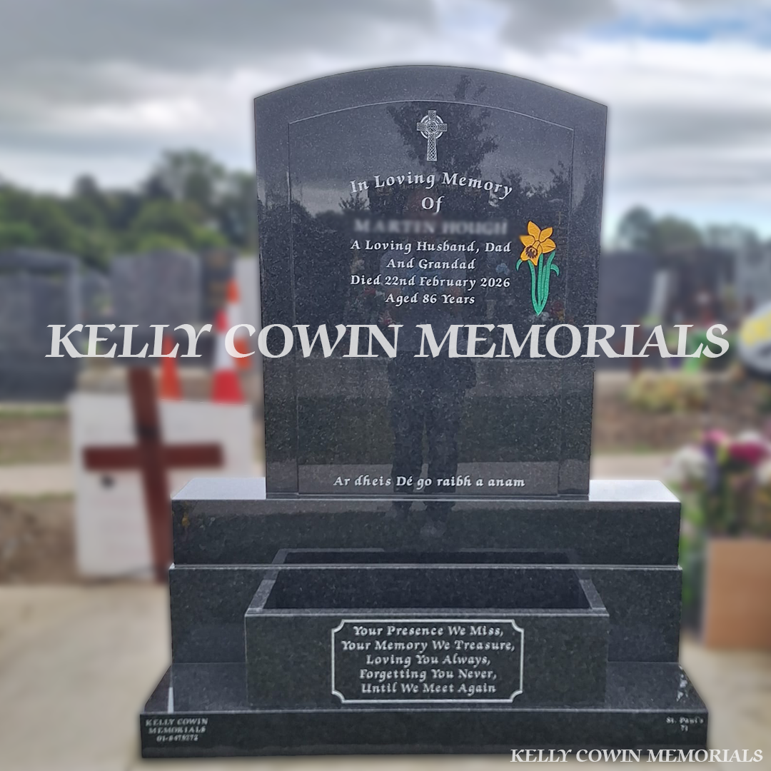 Rustenburg polished boulder granite headstone with silver inscription and matching flowerbox, erected in Balgriffin Cemetery, Dublin, by Kelly Cowin Memorials.