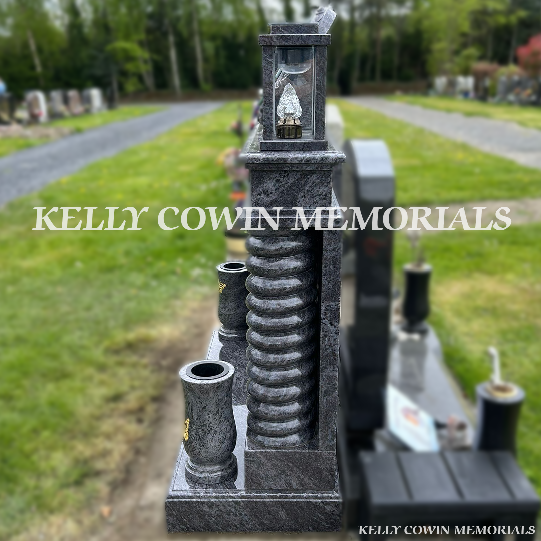 Side view of Blue Lagoon memorial with twisted pillars and lanterns