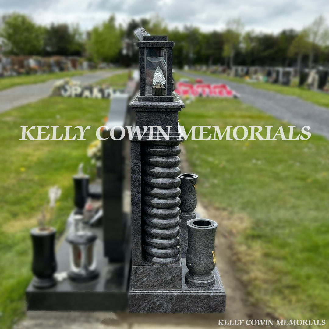 Side view of Blue Lagoon memorial with twisted pillars and lanterns