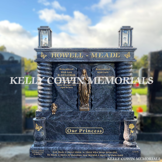 Blue Lagoon granite broken heart headstone with gold engraving, matching cap, backing plate, twisted pillars, two solar lanterns, two large granite vases and bronze flat-back Our Lady statue, erected in Shanganagh Cemetery, Dublin, by Kelly Cowin Memorials.