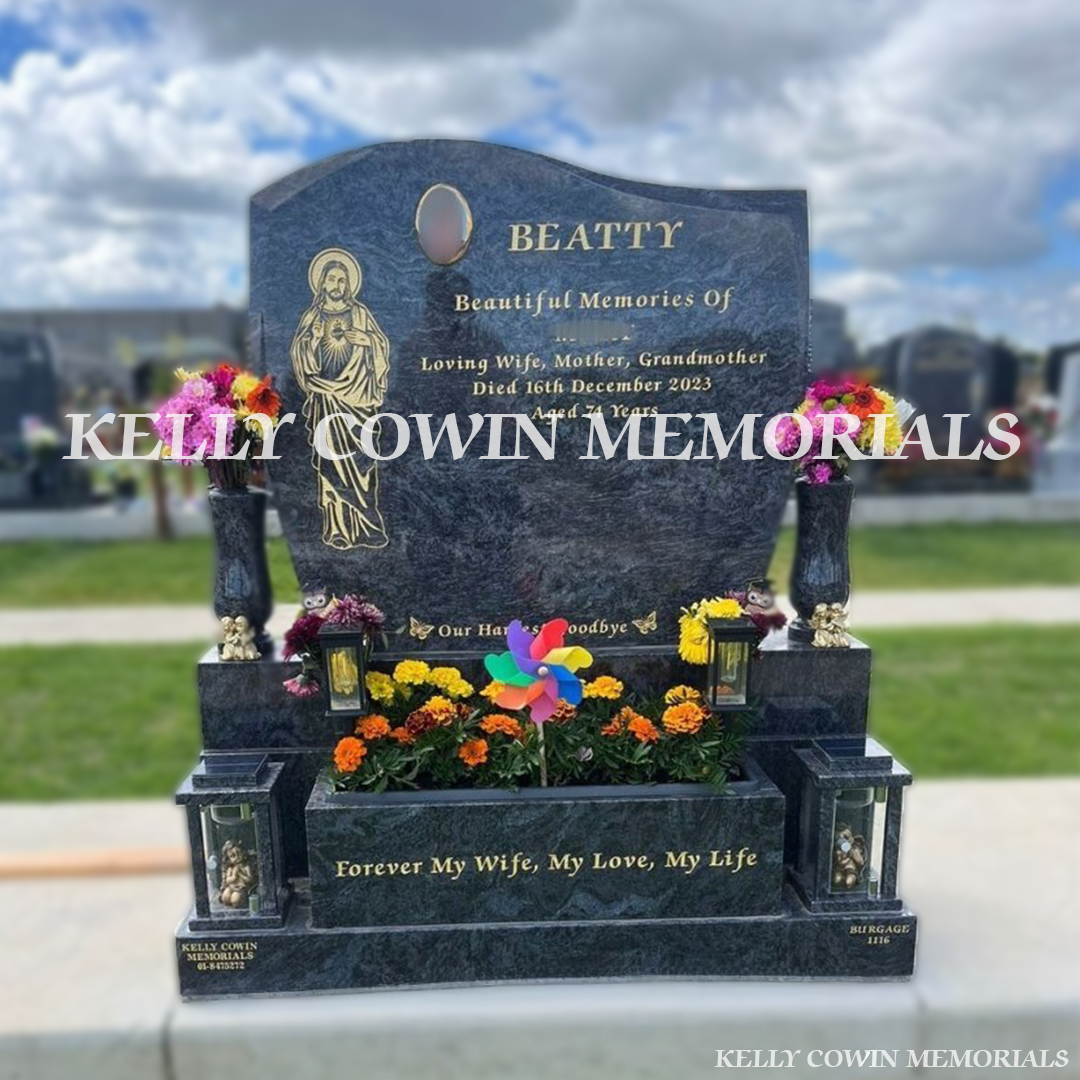 Front view of Blue Lagoon Granite C1 headstone on sub-base, base and plinth with flower box, lanterns and vases in Balgriffin Cemetery Dublin