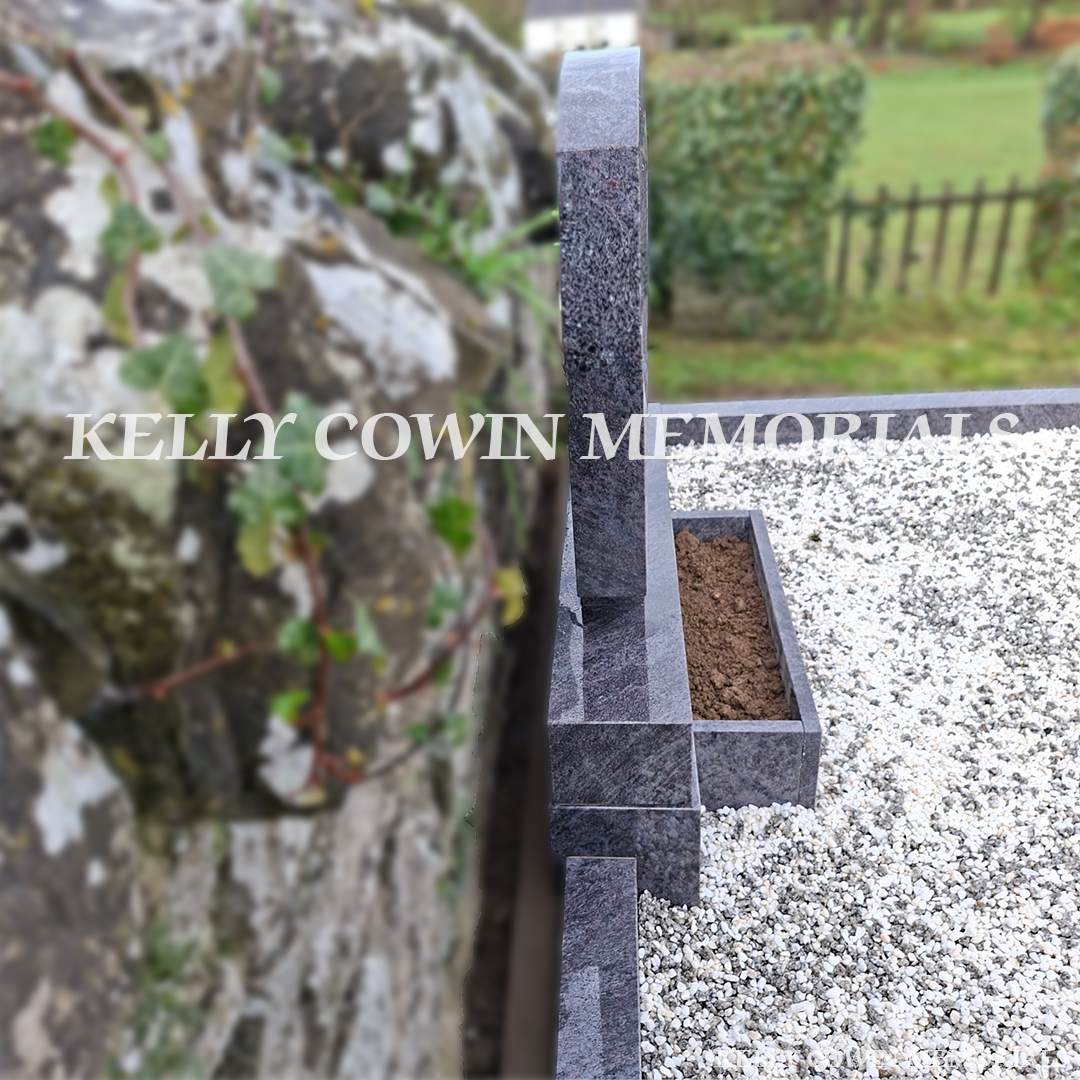 Close up side view of Blue Lagoon memorial with kerbing and mixed chippings