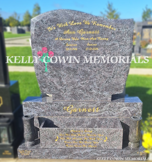 Blue Lagoon C1 polished granite headstone with curved top, gold inscription, colourful engraved roses, matching granite vases, flowerbox, sub-base, base and plinth in Balgriffin Cemetery, Dublin, by Kelly Cowin Memorials.