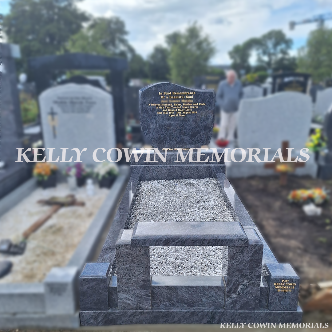 Blue Lagoon C1 headstone with full granite kerbing, integrated memorial seat, white chippings and gold leaf inscription installed in Mulhuddart Cemetery by Kelly Cowin Memorials.