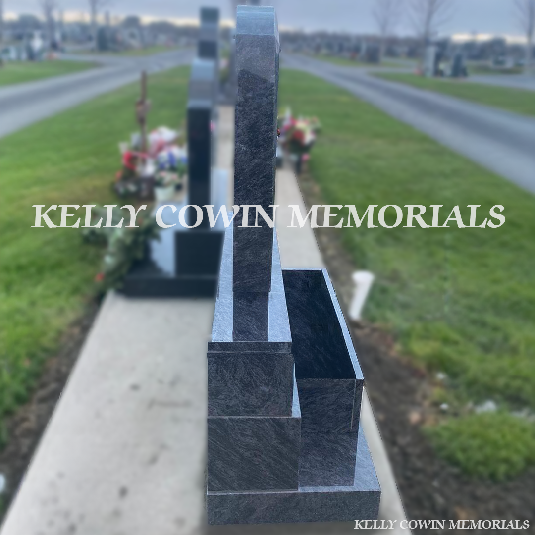 Side view of Blue Lagoon C1 headstone showing polished granite finish and flower box in Dardistown Cemetery