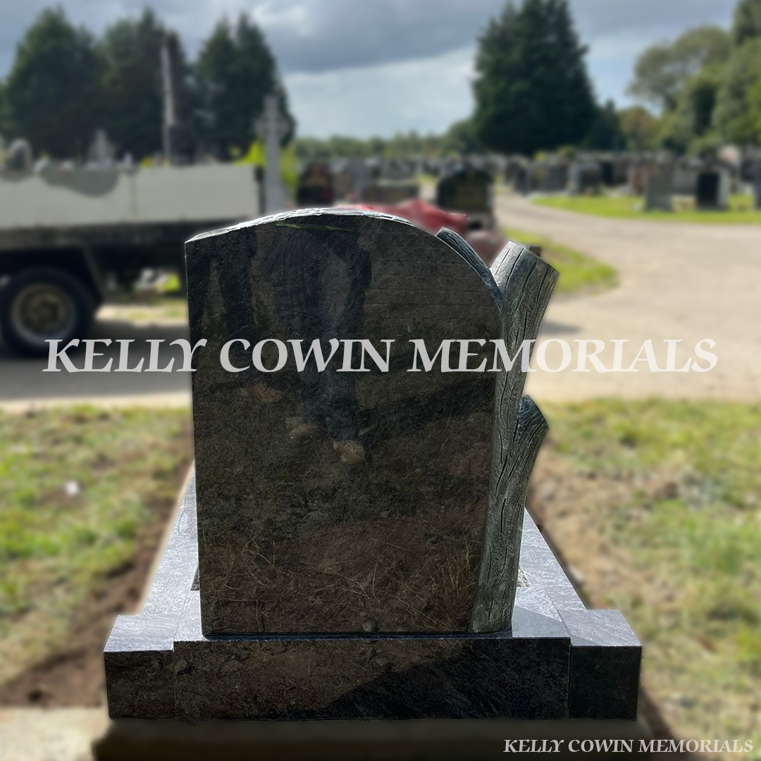 “Rear view of custom carved tree headstone in Esker Cemetery installed by Kelly Cowin Memorials Dublin”