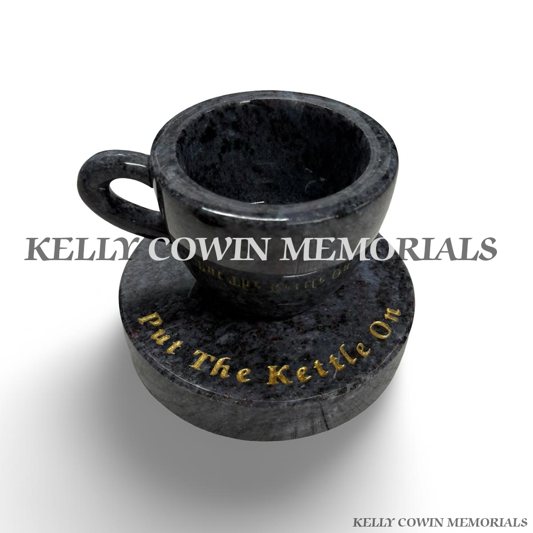 Blue Lagoon granite teacup memorial with handle on round grave plinth by Kelly Cowin Memorials Ireland