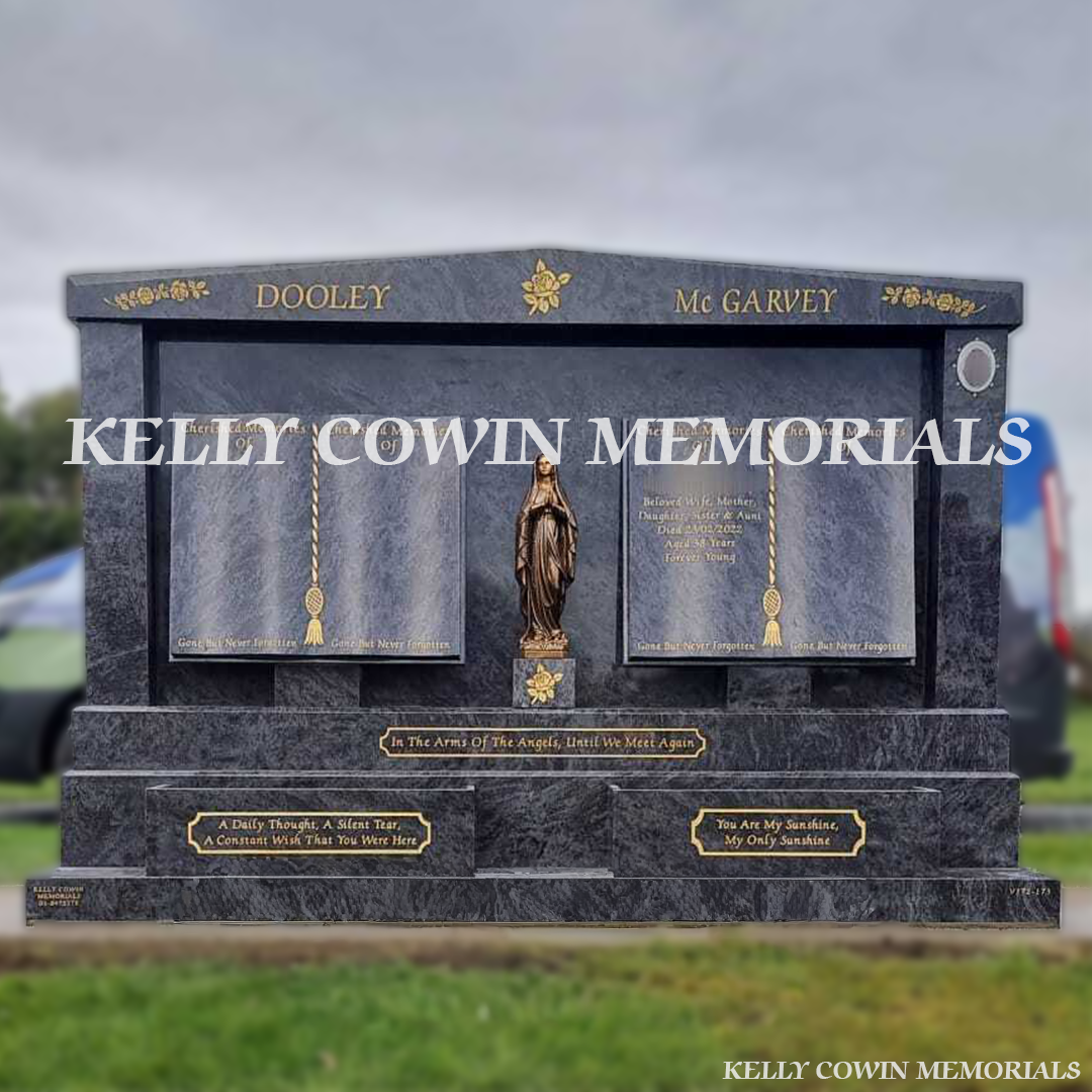 Front view of custom Blue Lagoon double book headstone with gold inscription and bronze Our Lady statue in Dardistown Cemetery Dublin