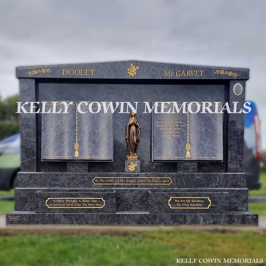 Front view of custom Blue Lagoon double book headstone with gold inscription and bronze Our Lady statue in Dardistown Cemetery Dublin