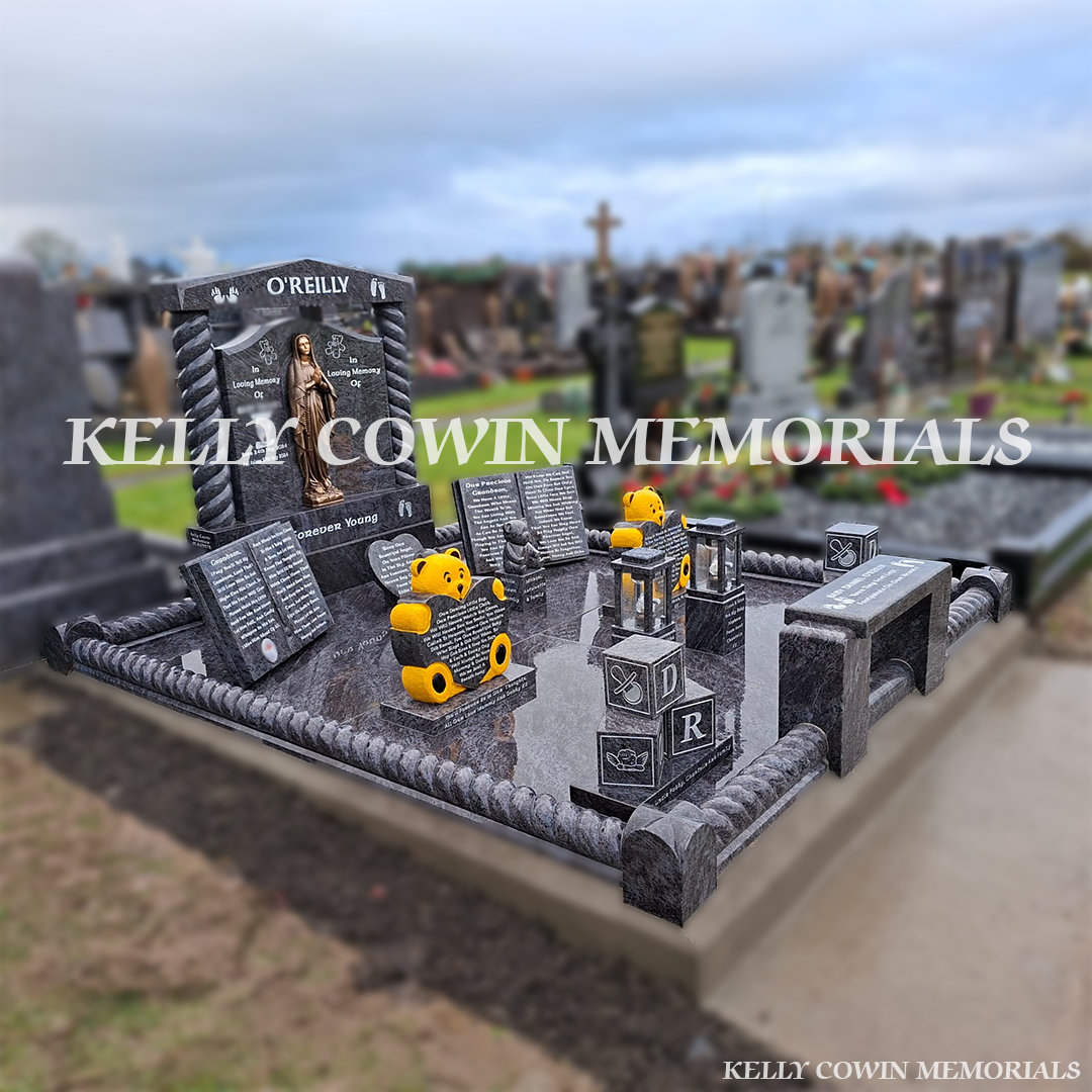 Side view of Blue Lagoon granite Gates of Heaven headstone showing twisted pillars, base and plinth, full granite floor and roped kerbing in a Tipperary cemetery