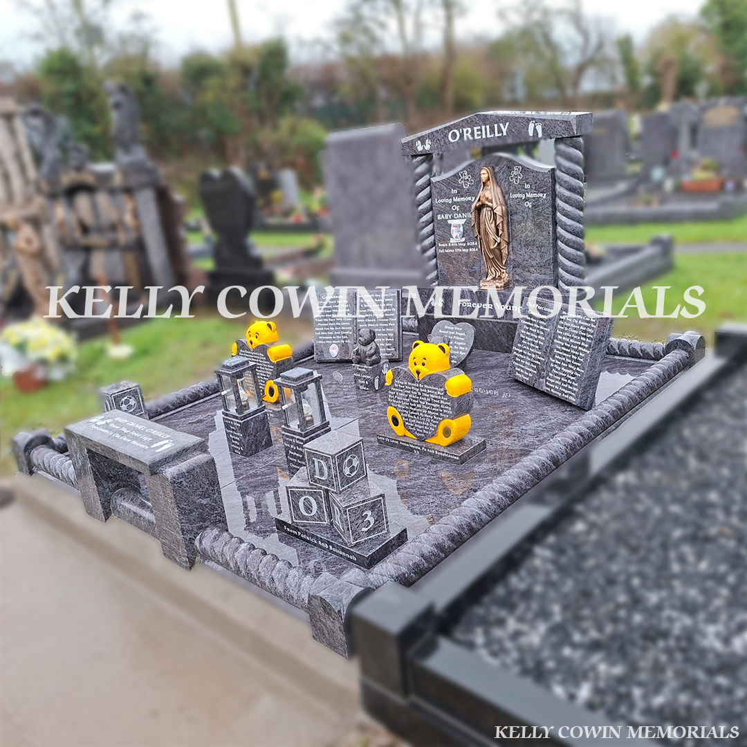 Side view of Blue Lagoon granite Gates of Heaven headstone showing twisted pillars, base and plinth, full granite floor and roped kerbing in a Tipperary cemetery